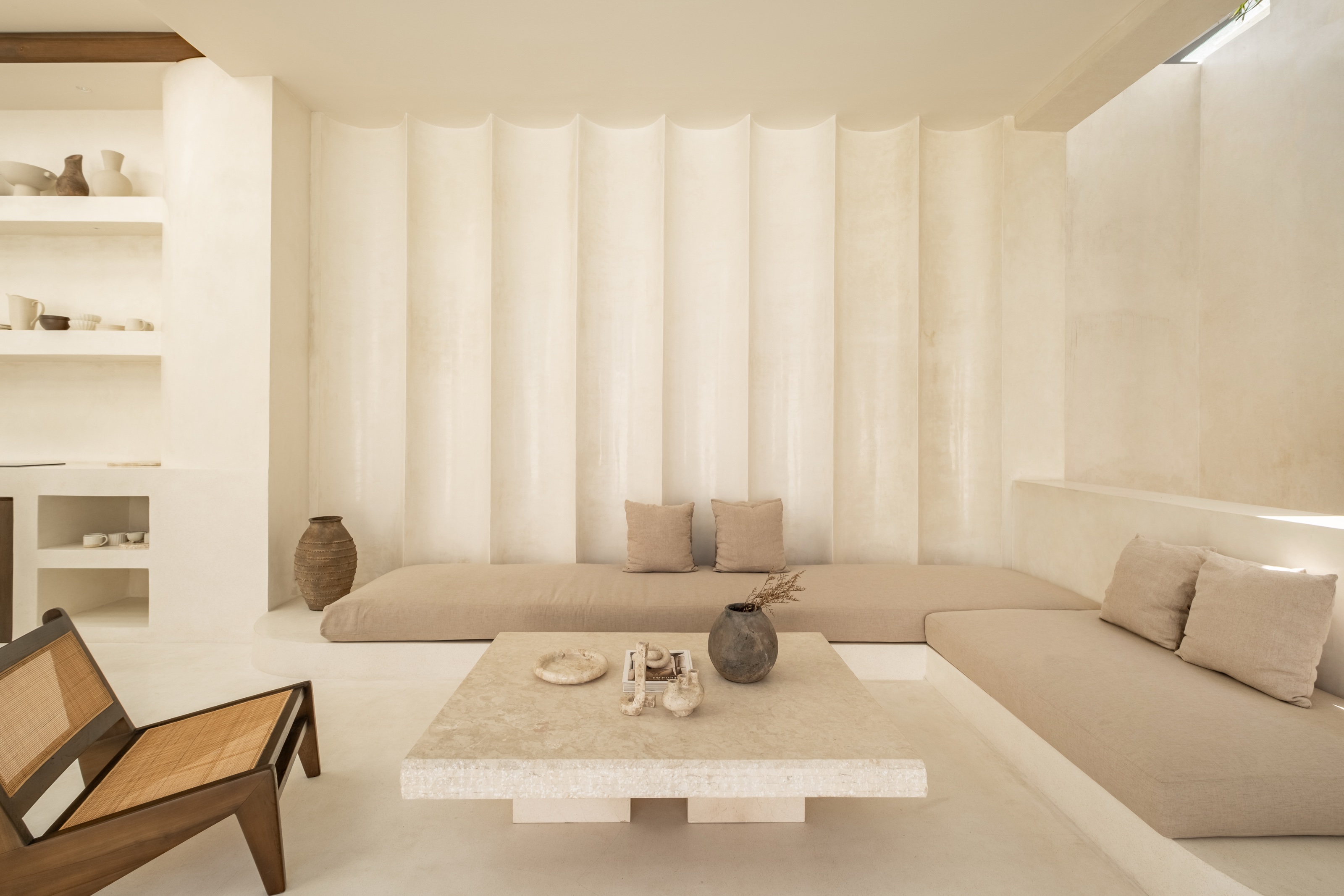 Living room opening onto the pool at Villa 02